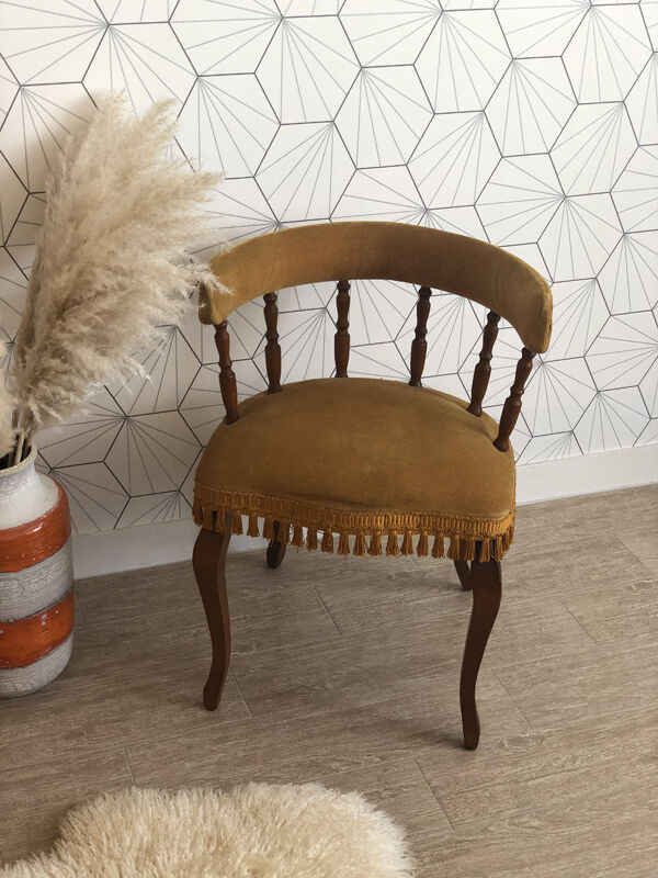Vintage fringed gondola armchair