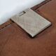 Underhand in saddle leather and vintage brushed metal