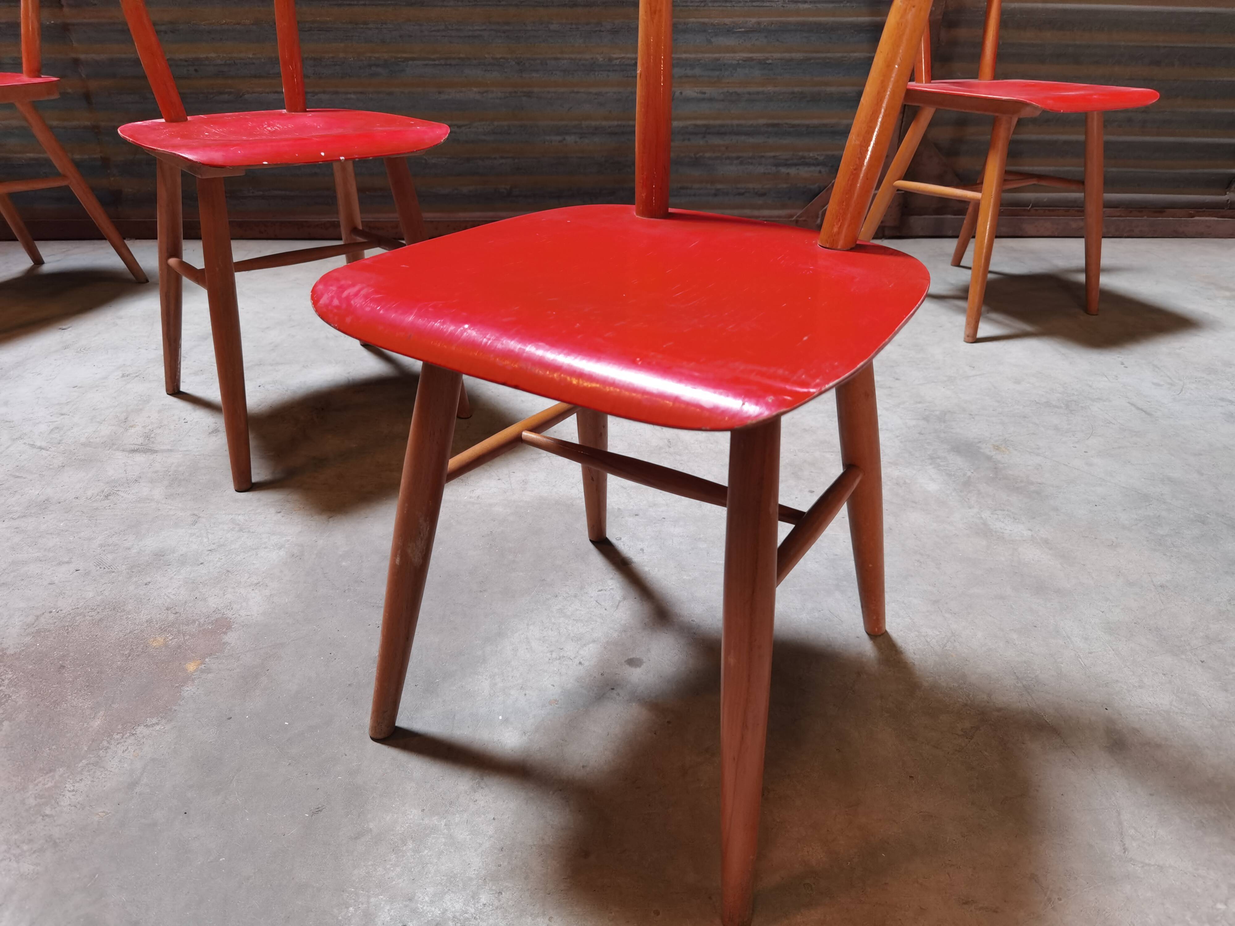Set of 4 red wooden chairs published by Ton, 60s