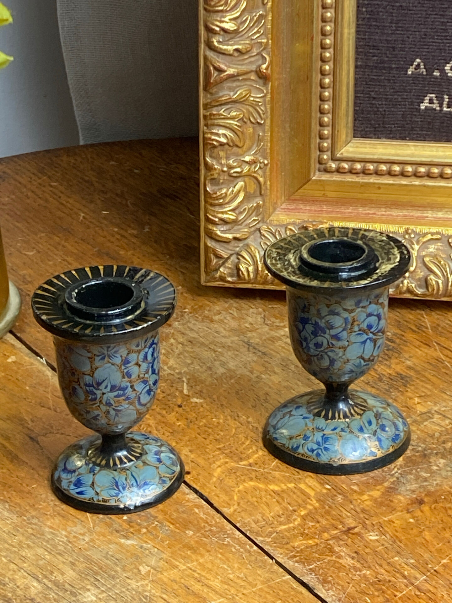 Pair of Kashmiri candlesticks, lacquered papier-mâché