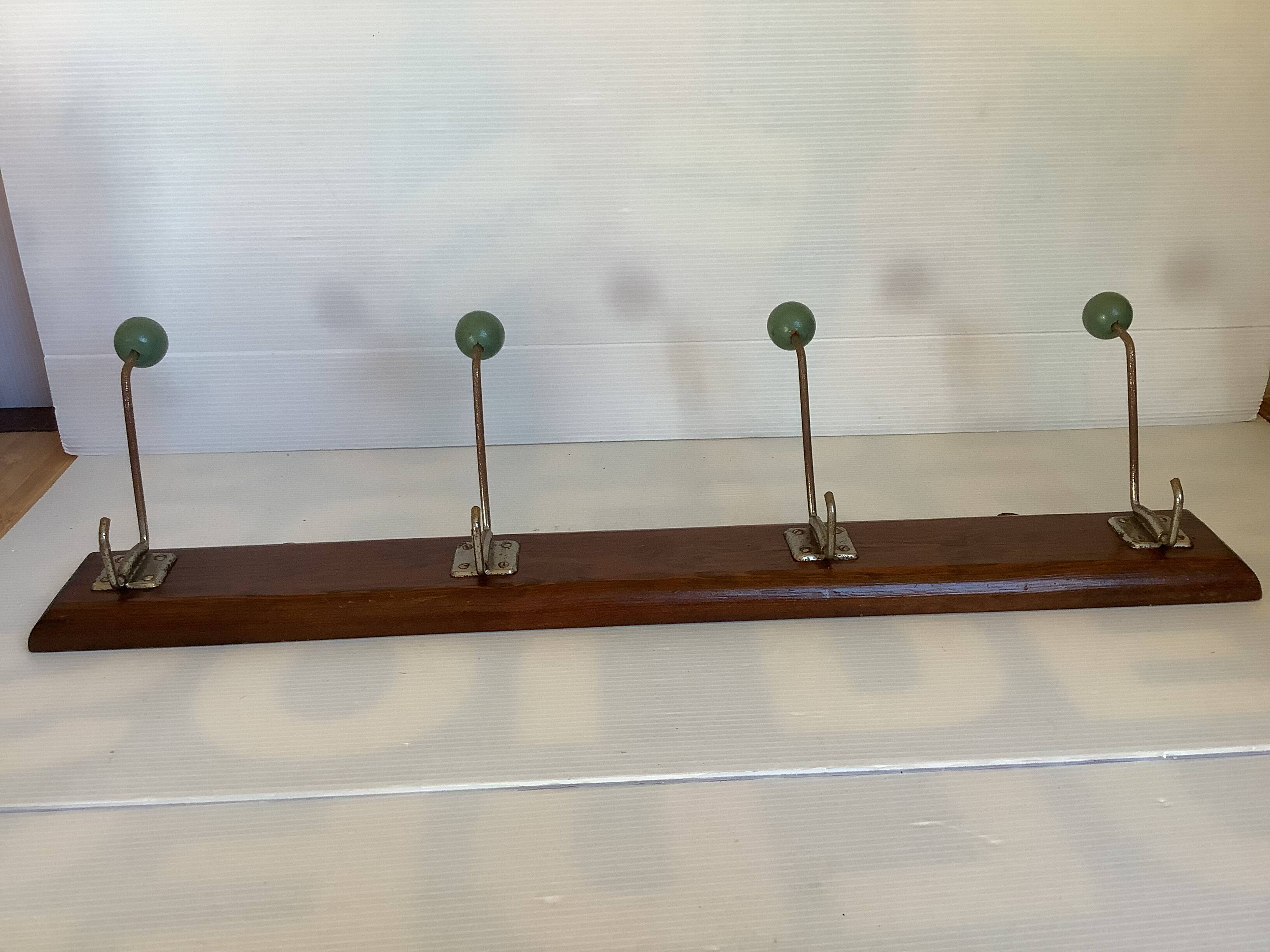 Old coat rack green balls wood metal