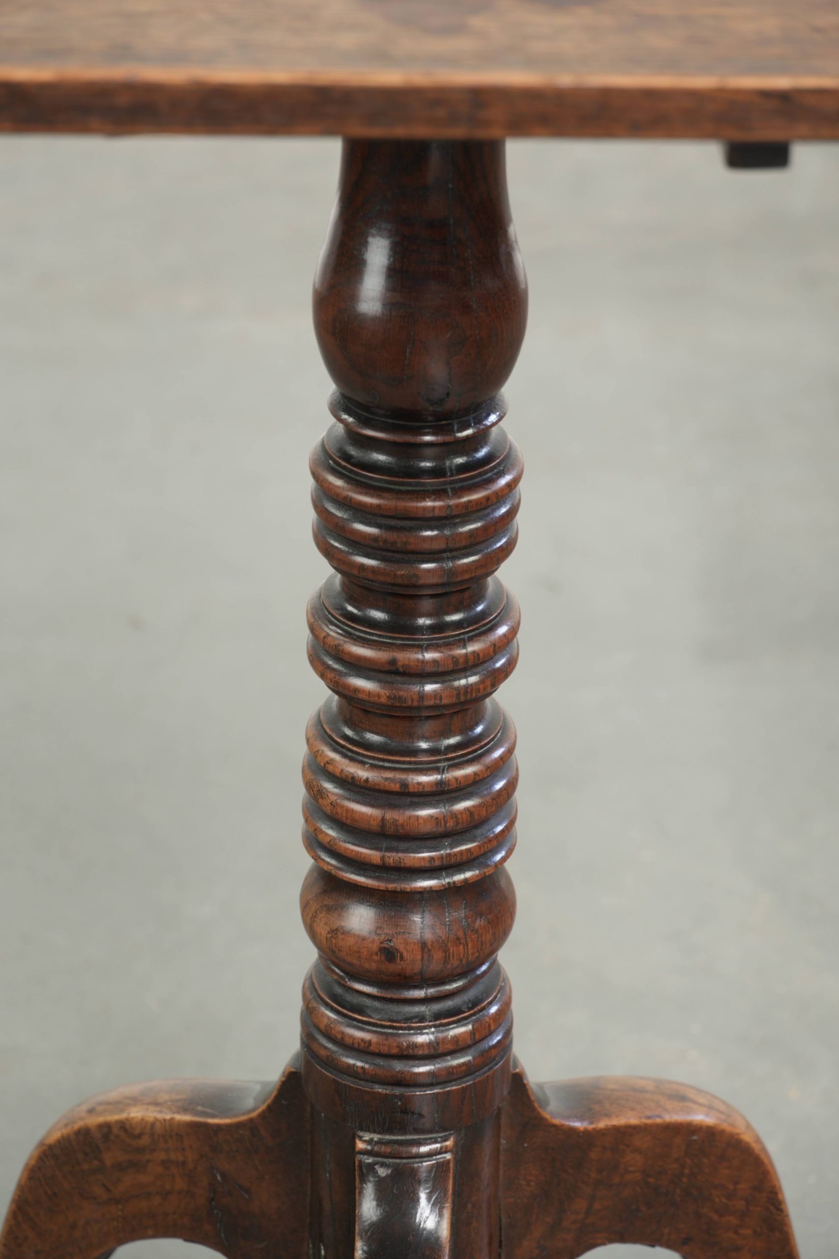 Antique English oak tilt top table from the 19th century in a unique shape
