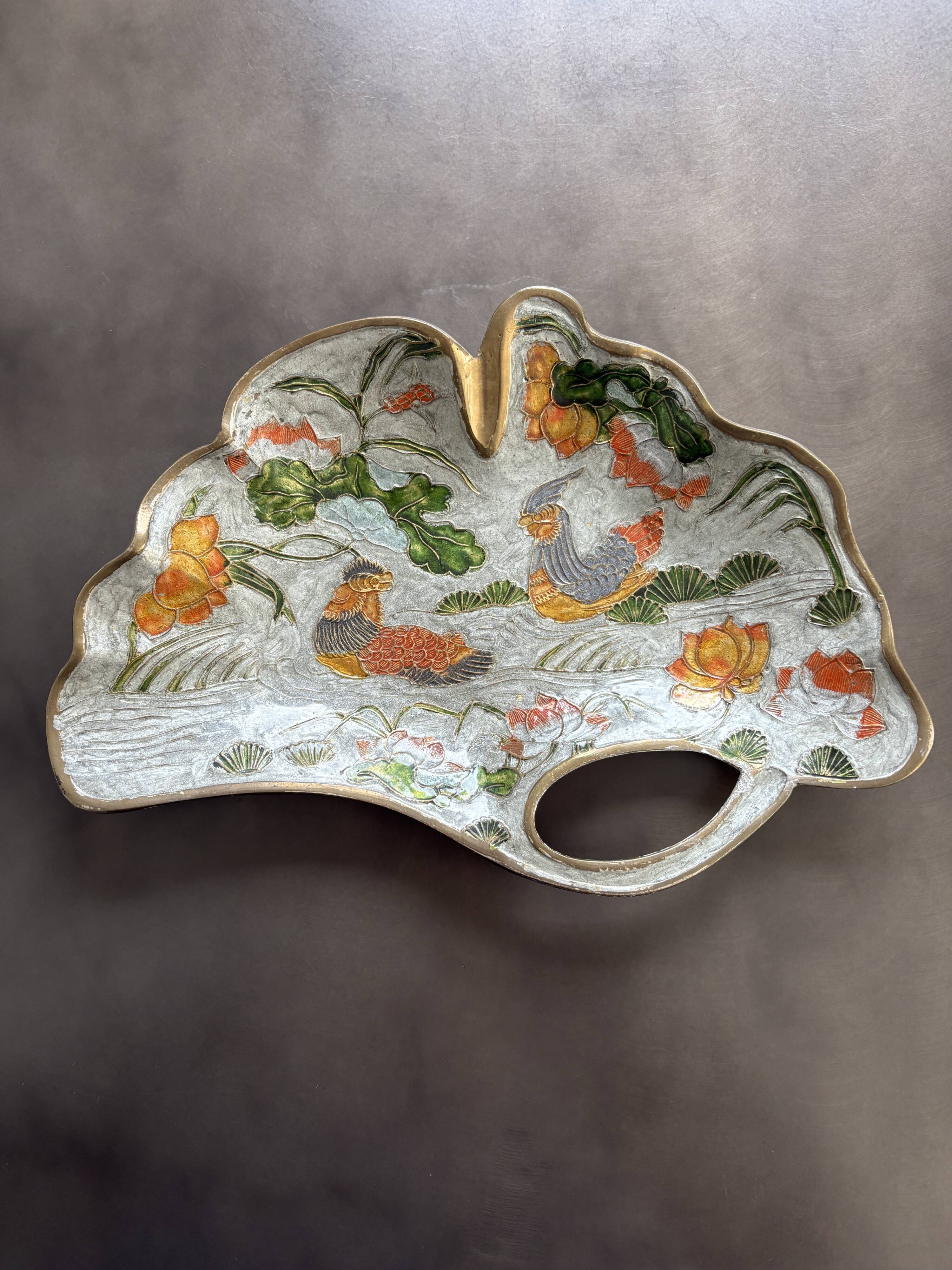 Old brass pocket emptier