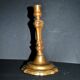 Antique candle holder, carved in bronze, 18th century.