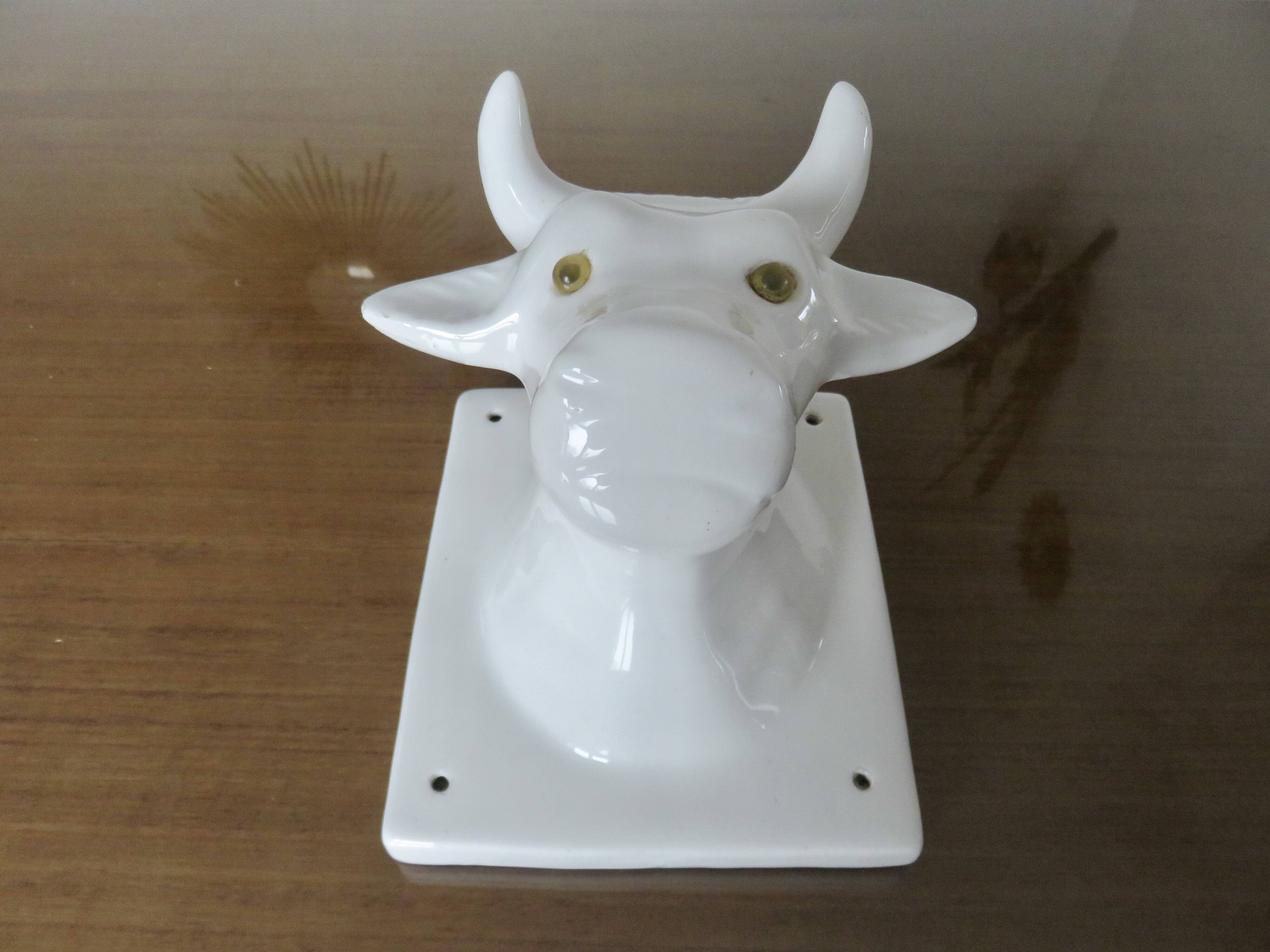 Stylized cow head in white ceramic, wall decoration from the 80s