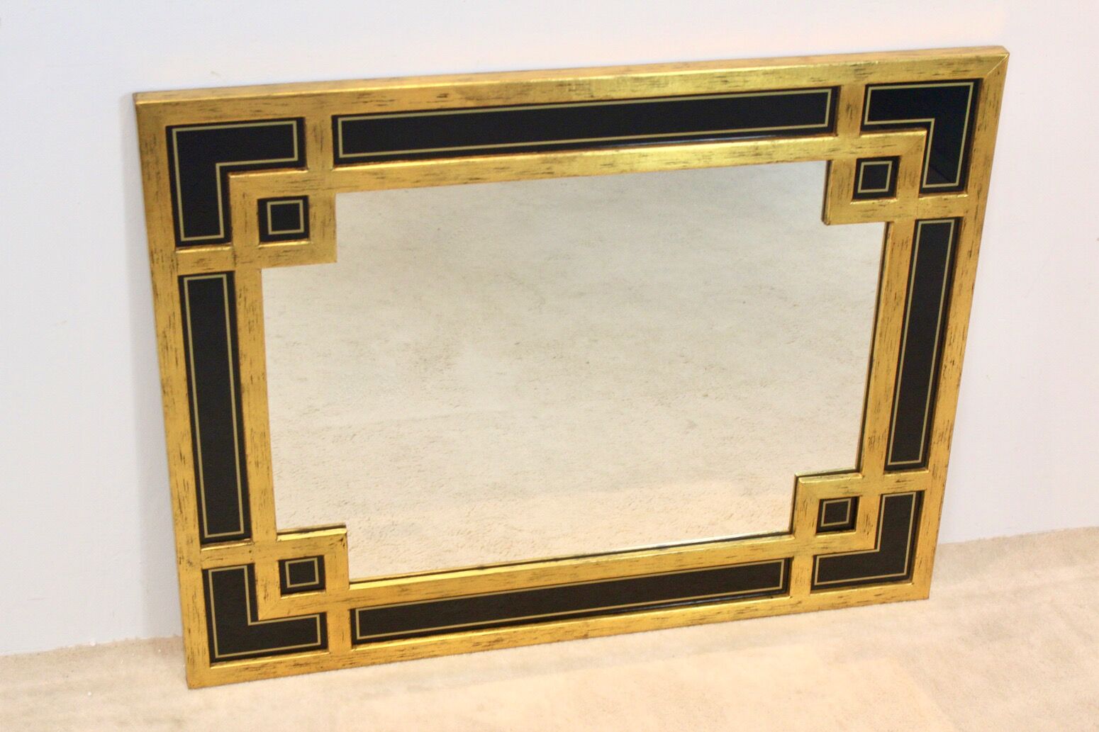 Mirror in gilded wood and black glass by Deknudt Belgium