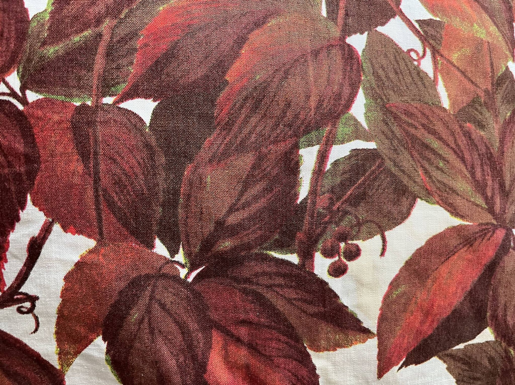 Vintage cushion with virgin vine leaf pattern.