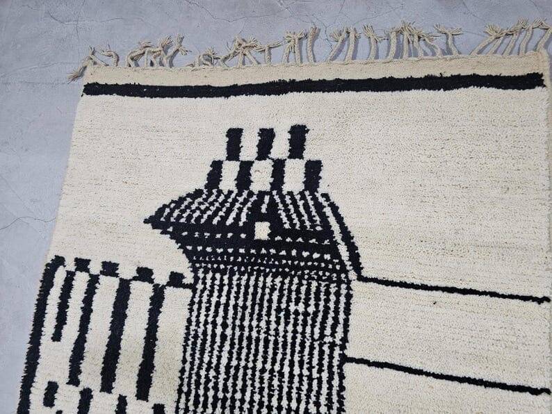 Handmade pure wool rug in black and white, size 150 x 250 cm.