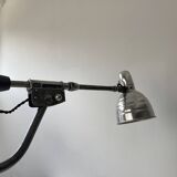 Old industrial wall light with counterweight.