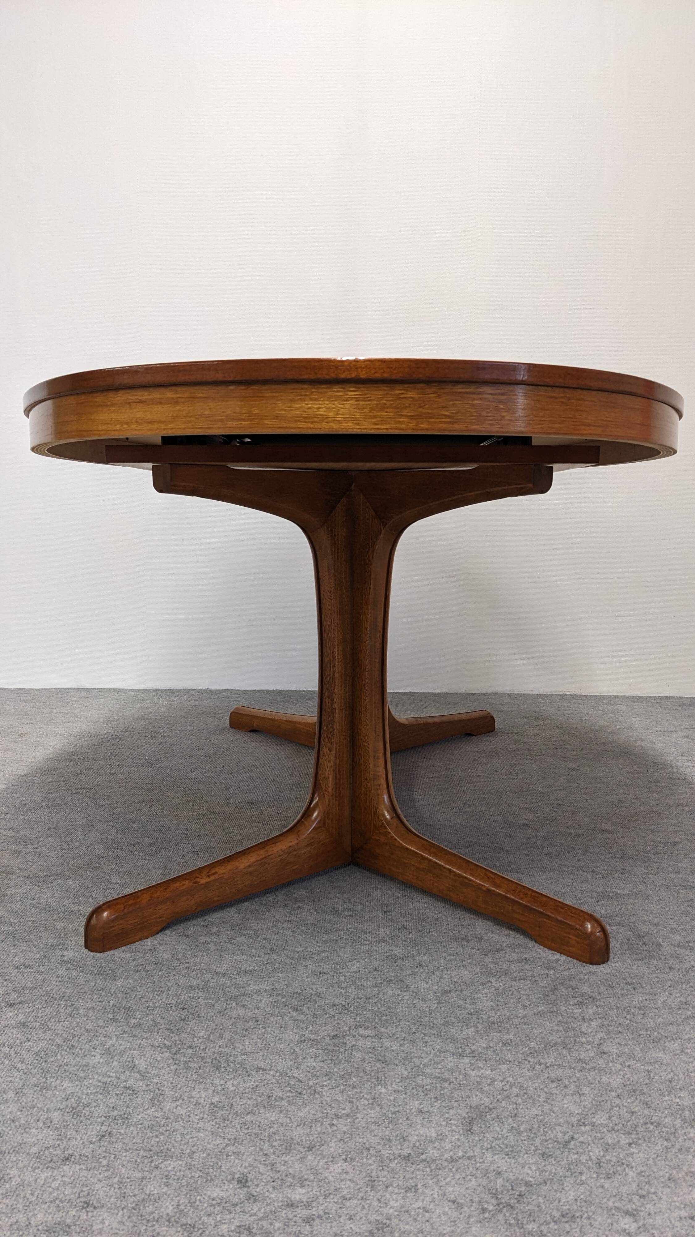 Oval extendable dining table by Baumann, France circa 1970.