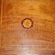 Sheraton-style rotating library table in walnut and satinwood.