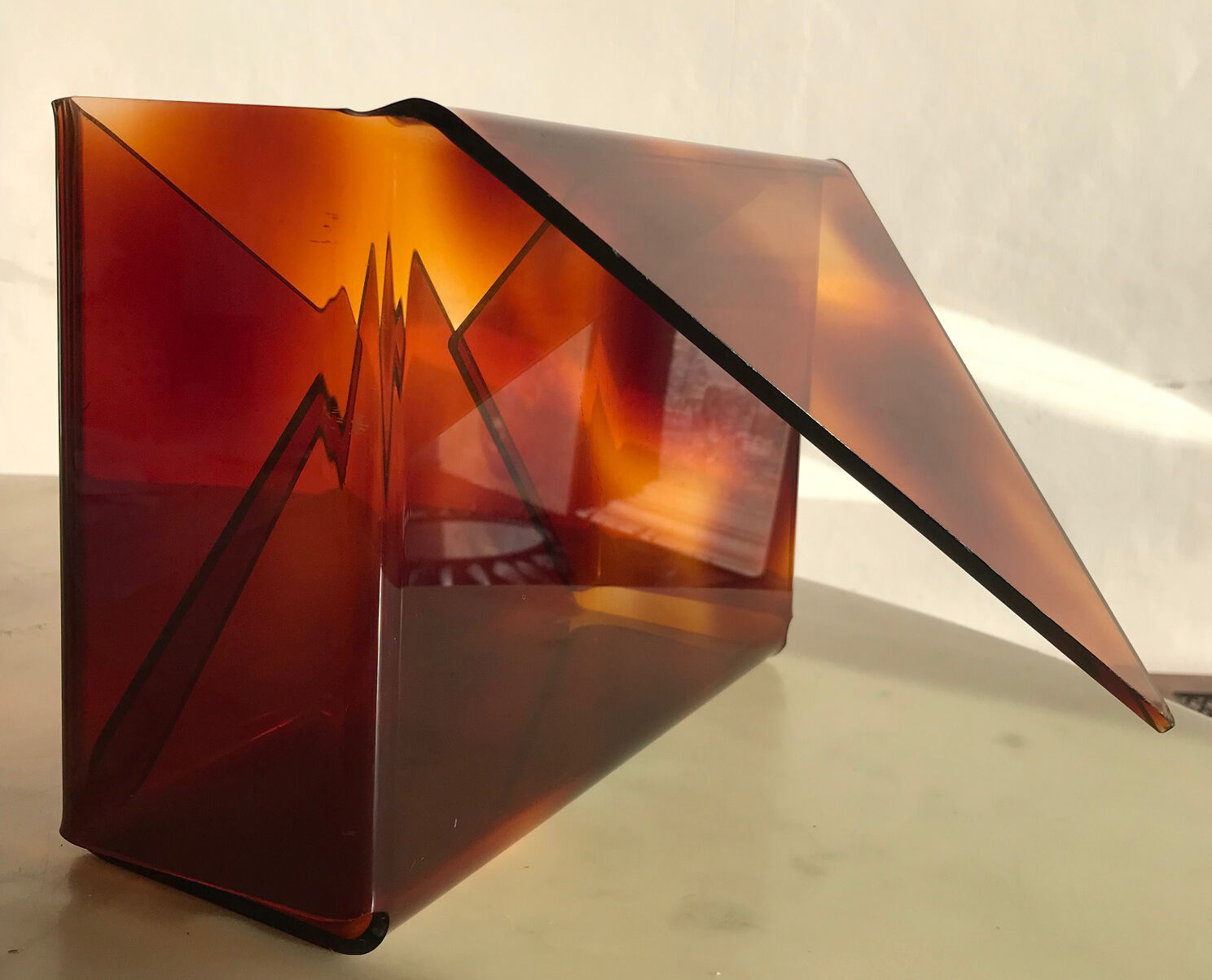 Revised door or document holder in smoked plexiglass from the 1970s