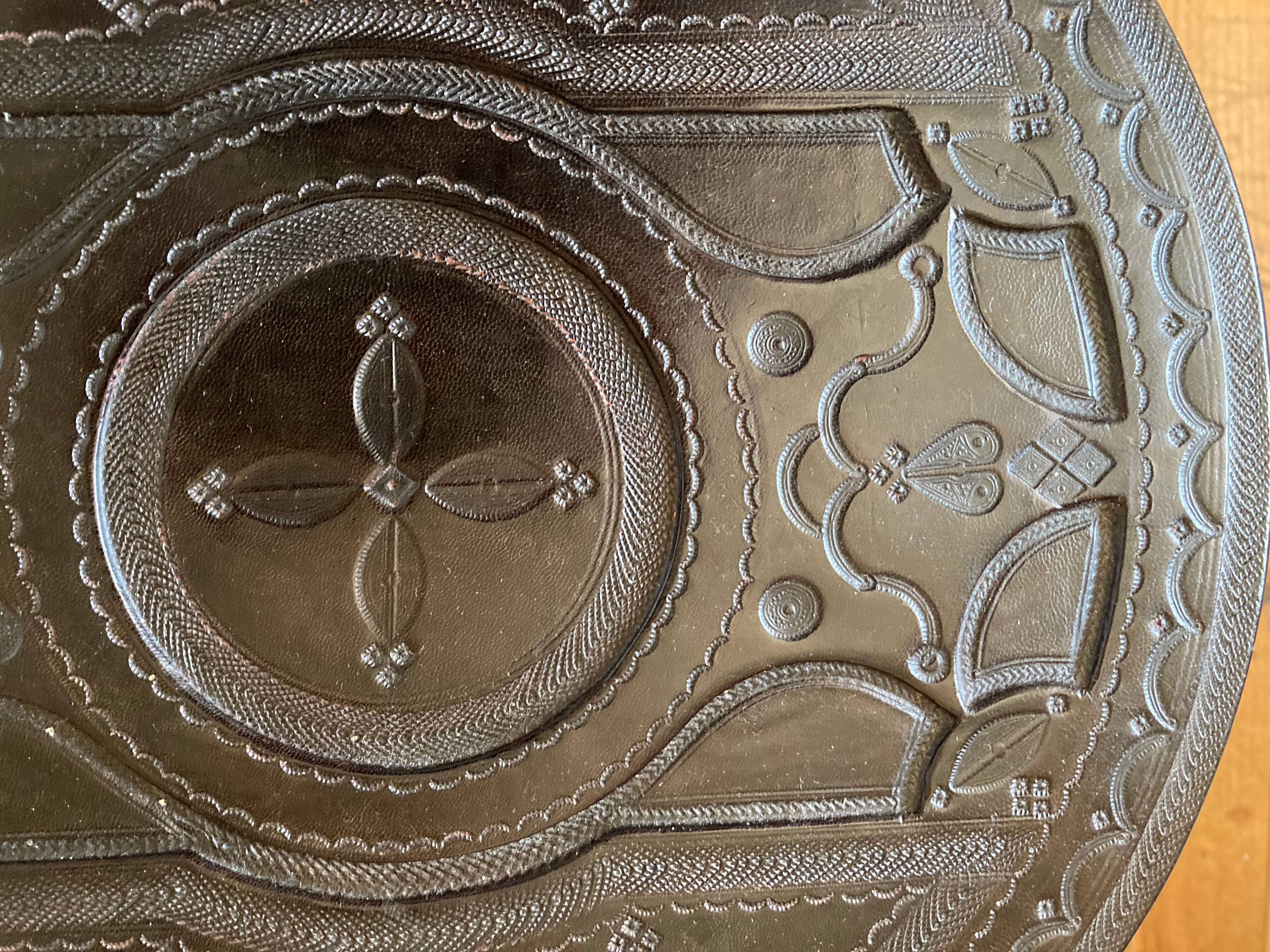 Touareg pedestal tables in wood and embossed leather