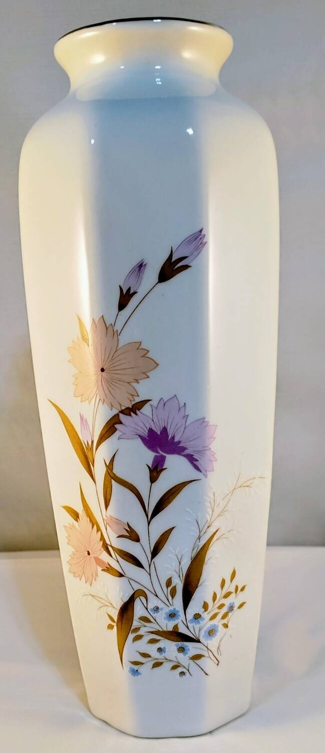 White ceramic vase with floral patterns