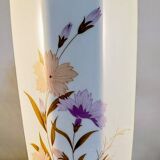 White ceramic vase with floral patterns