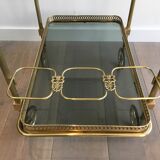 Neoclassical style rolling table in brass with blue glass tops