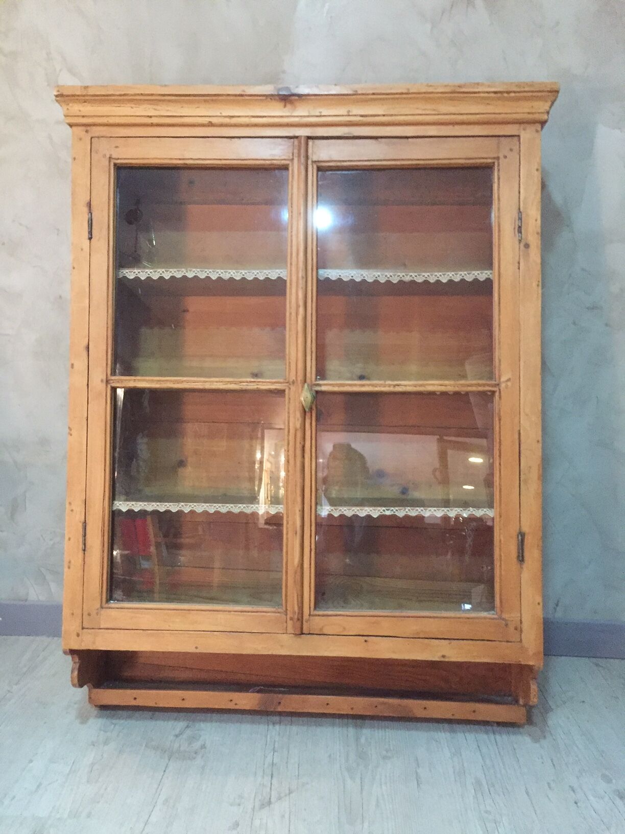 Suspended in early twentieth century tree window