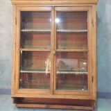 Suspended in early twentieth century tree window