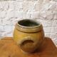 Old yellow glazed terracotta pot