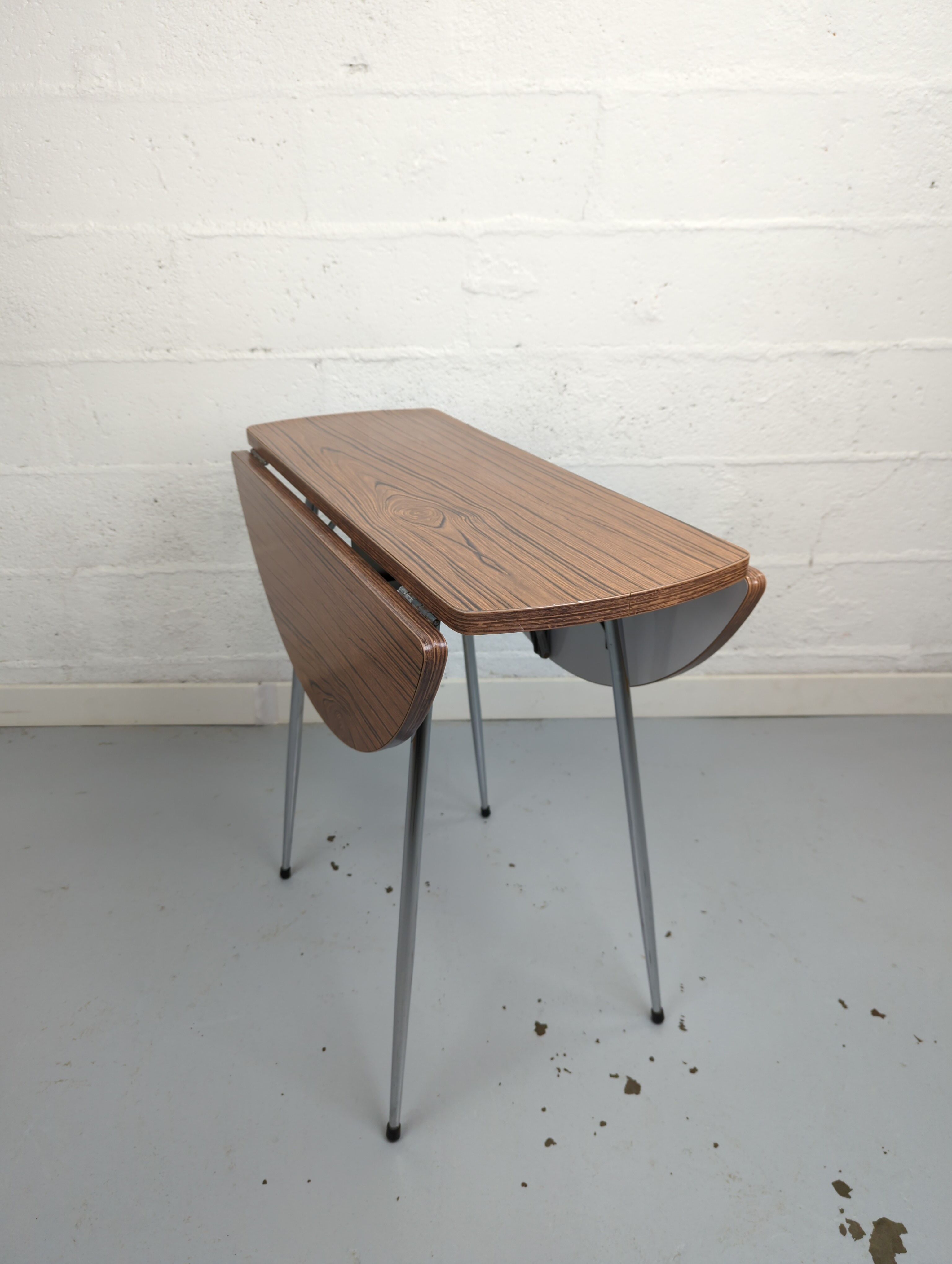 Foldable brown formica table compass legs