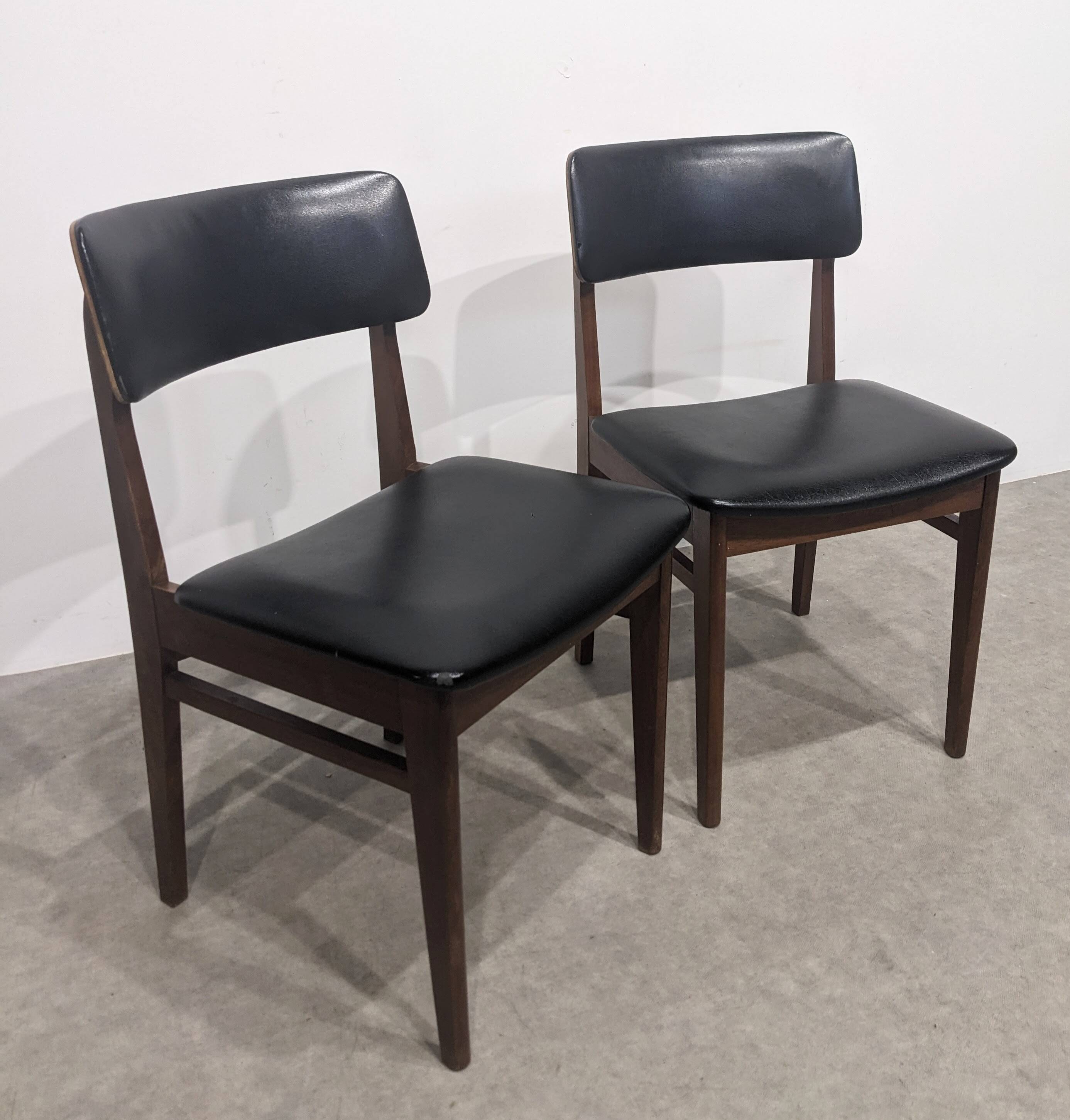 Two mid-century faux leather chairs