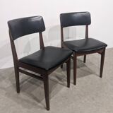 Two mid-century faux leather chairs