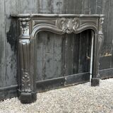 Louis XV style fireplace in black Belgian marble, circa 1880.