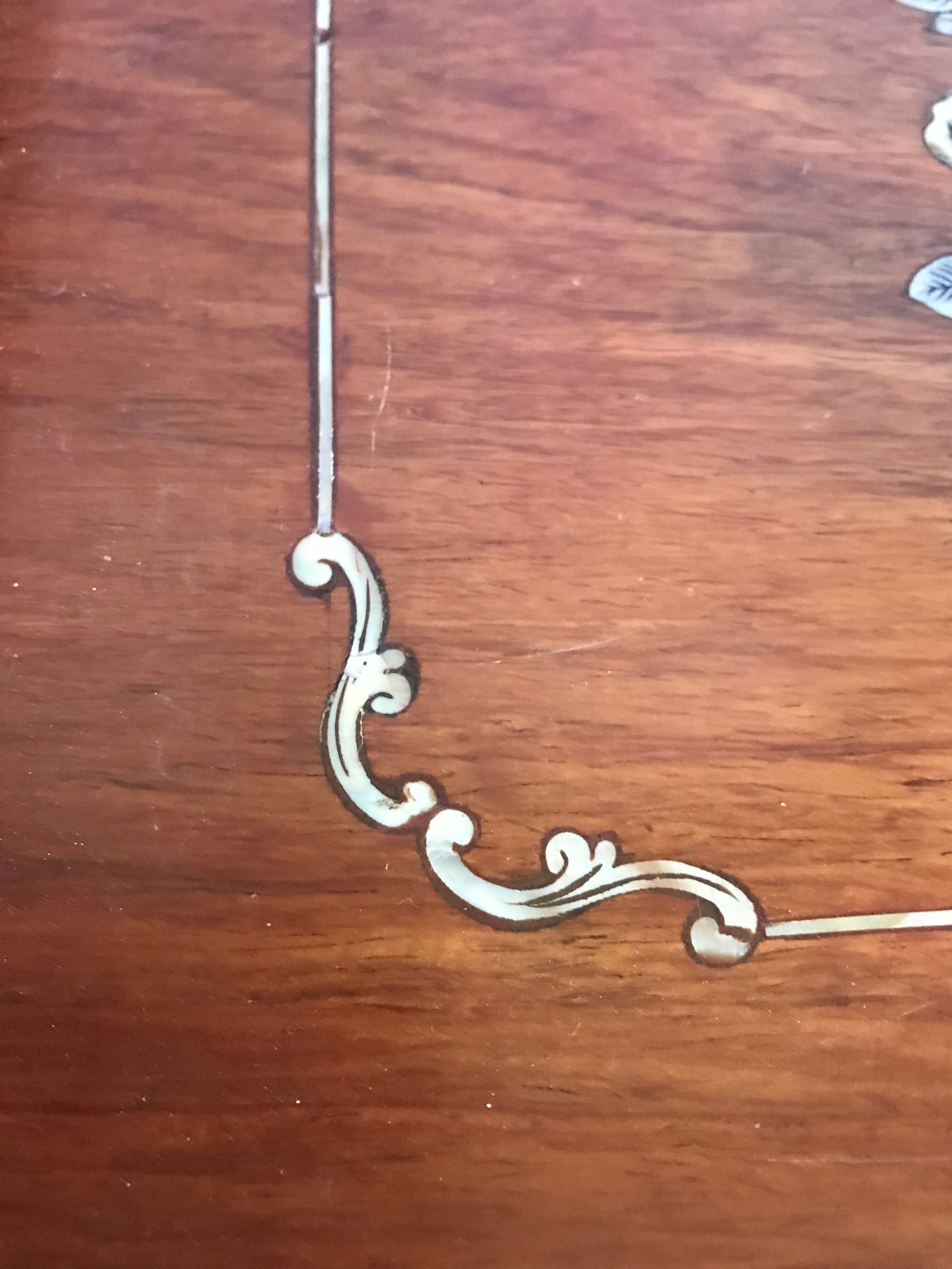 Wood and mother-of-pearl top