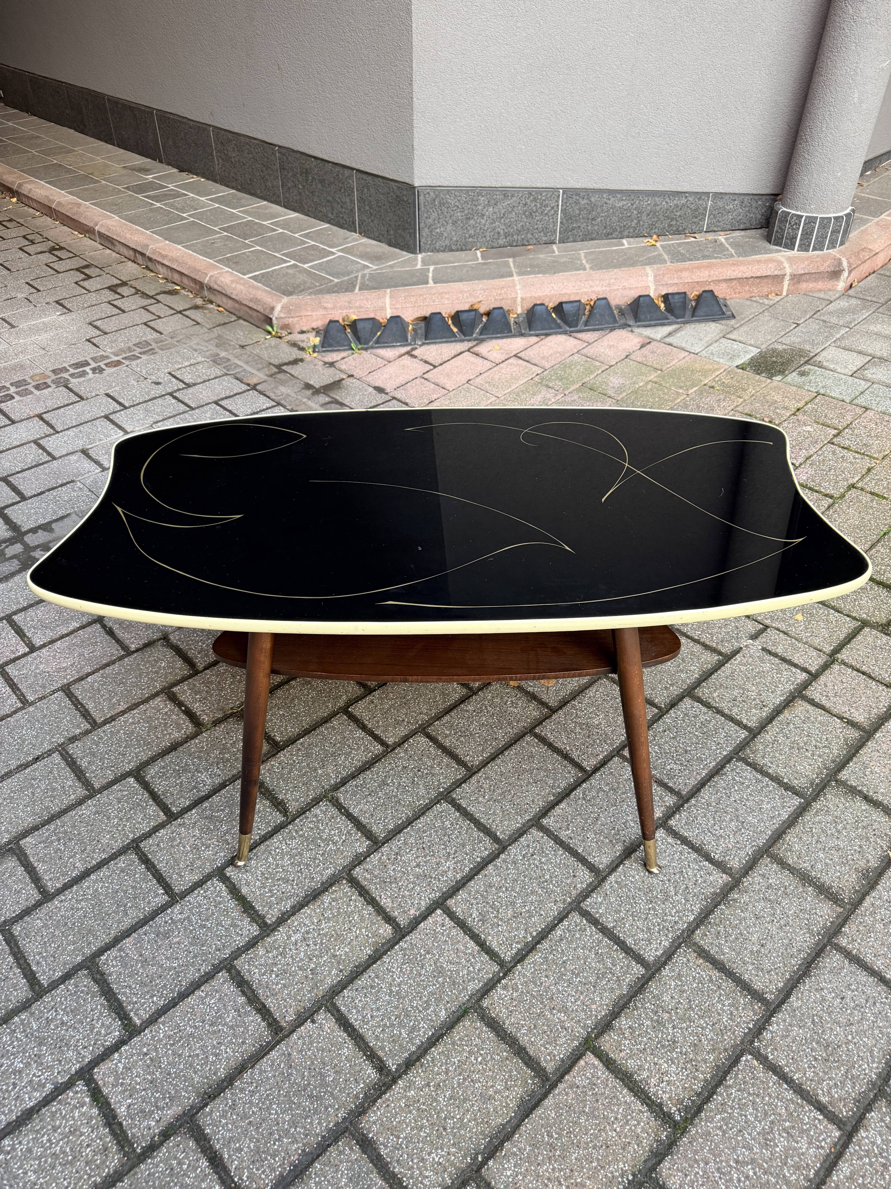 Black glass and wood coffee table