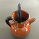 Glazed amber jug