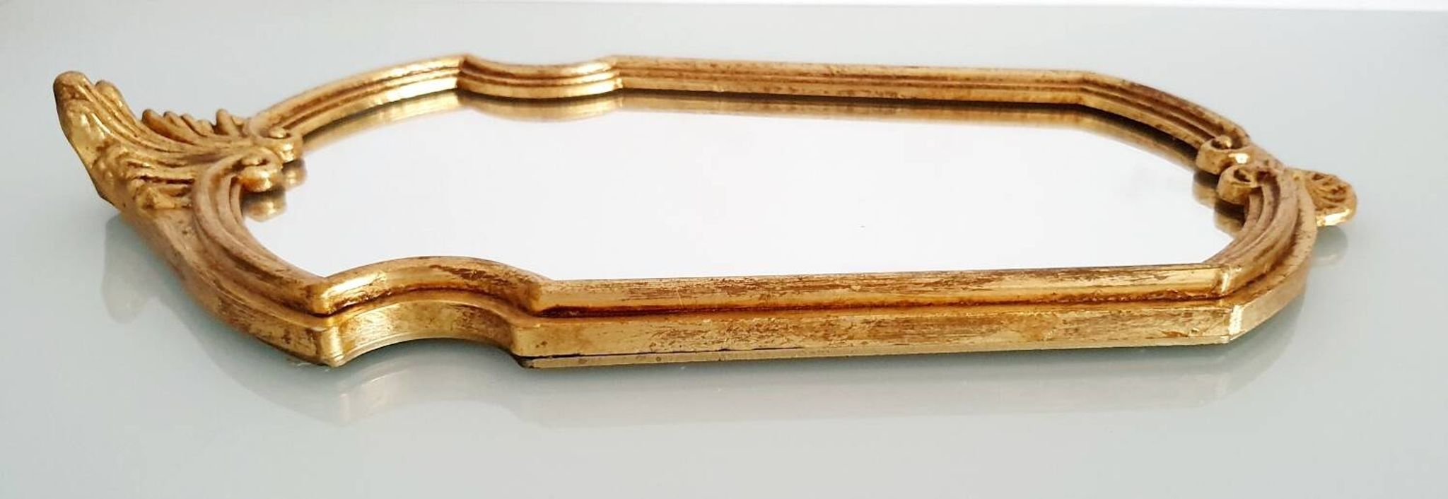 Miroir en bois doré à la feuille d'or