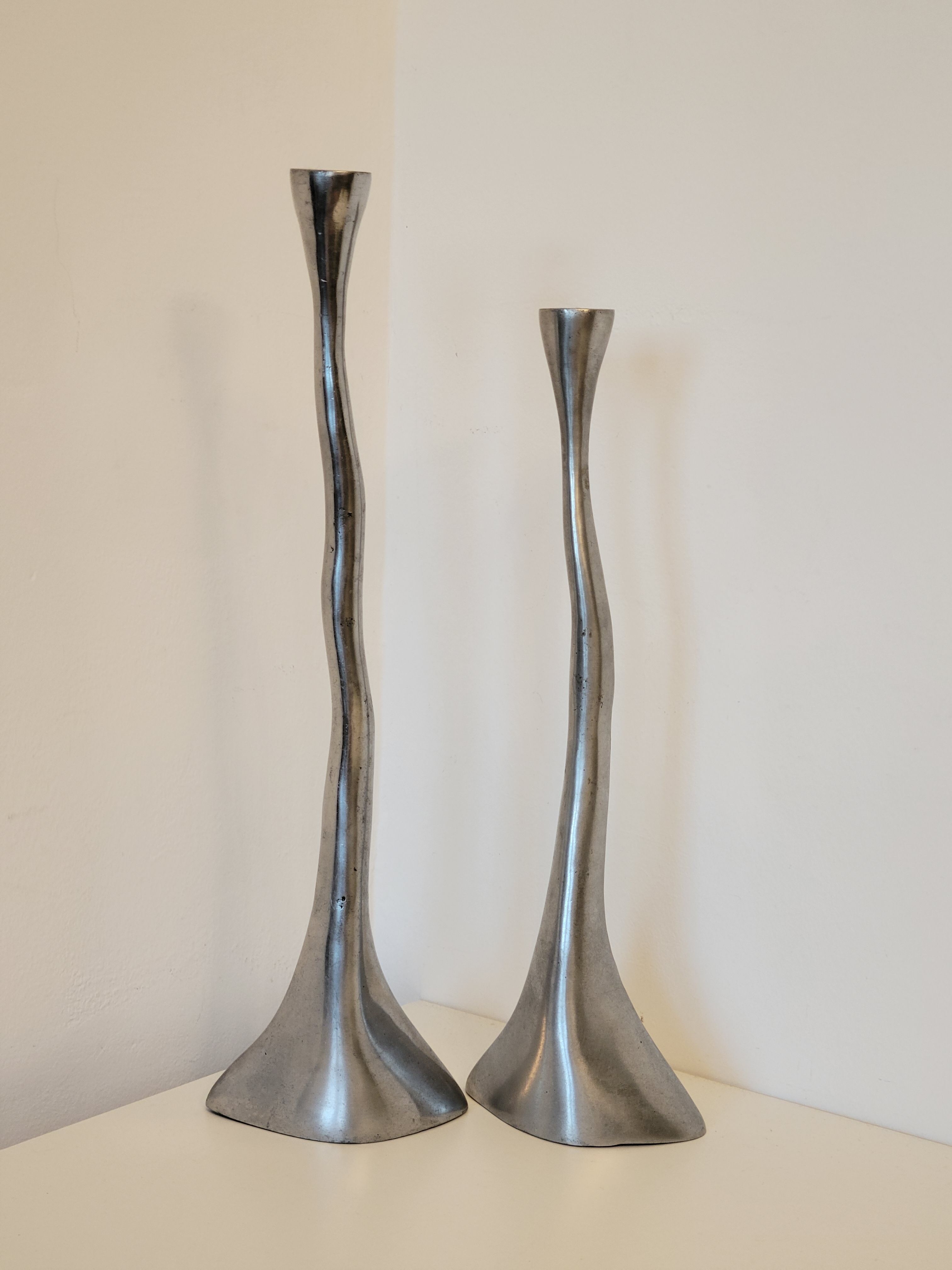 Pair of brutalist metal candlesticks in organic shape sleek design