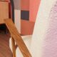 Vintage beige bouclé armchair with walnut wood from the 1950s.