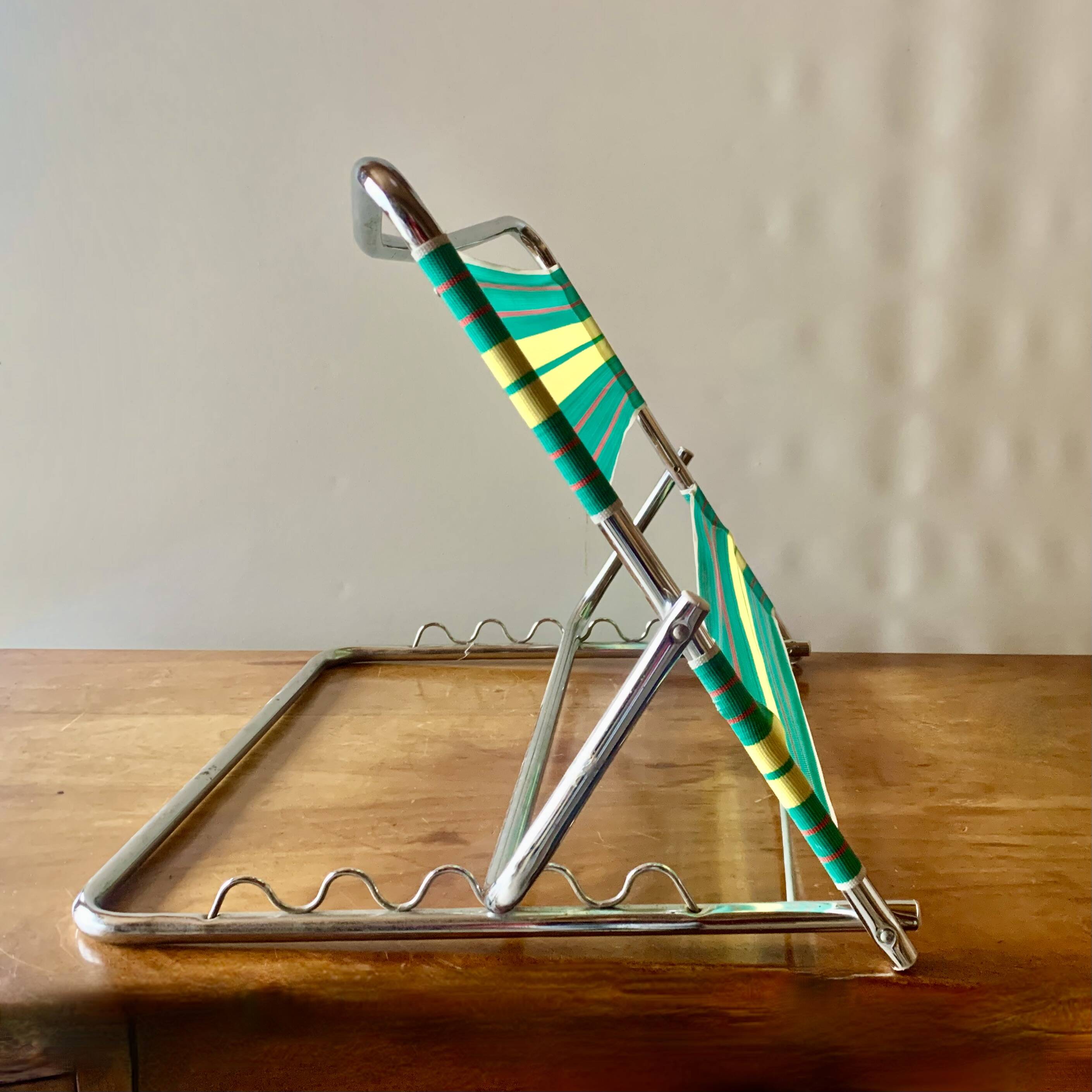 Vintage folding beach chair in chrome metal and woven plastic