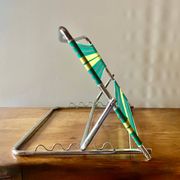 Vintage folding beach chair in chrome metal and woven plastic