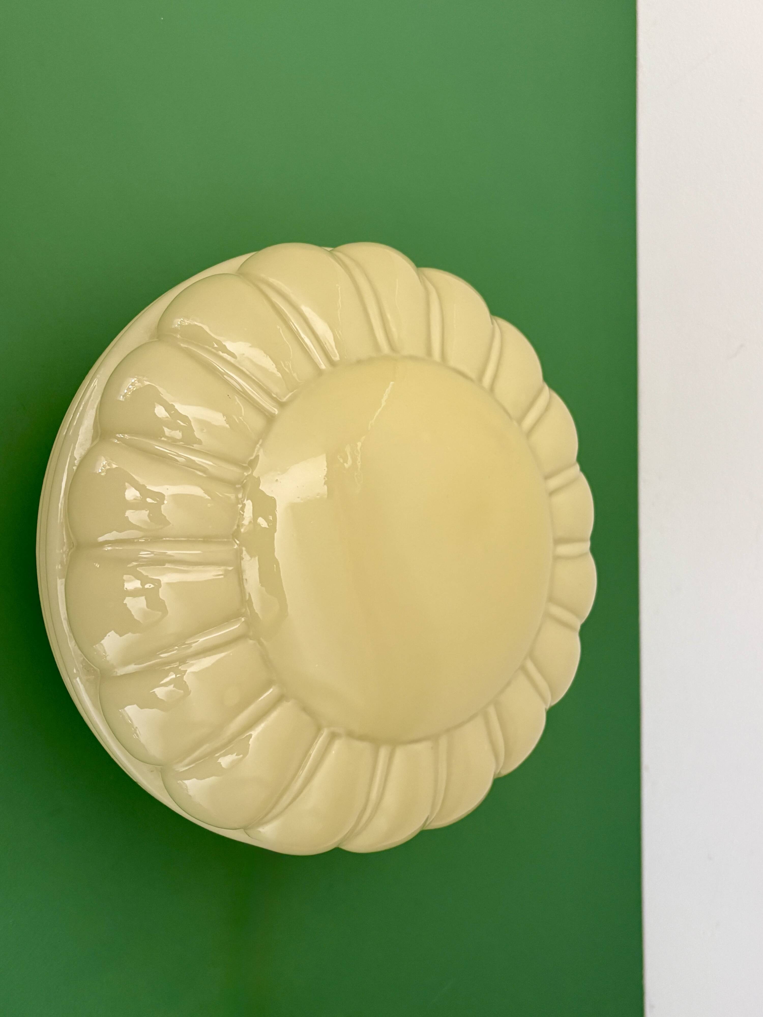 Vintage Art Deco globe wall or ceiling light in yellow opaline.
