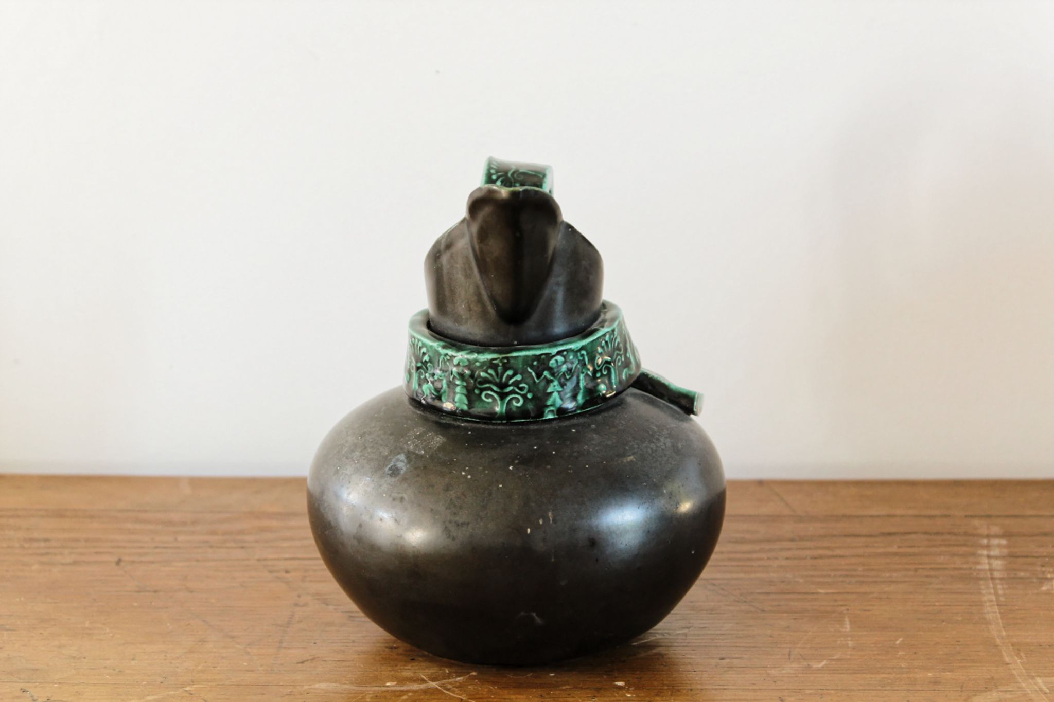 Pitcher in earthenware, metallic black