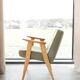 Vintage olive green bouclé armchair model 366