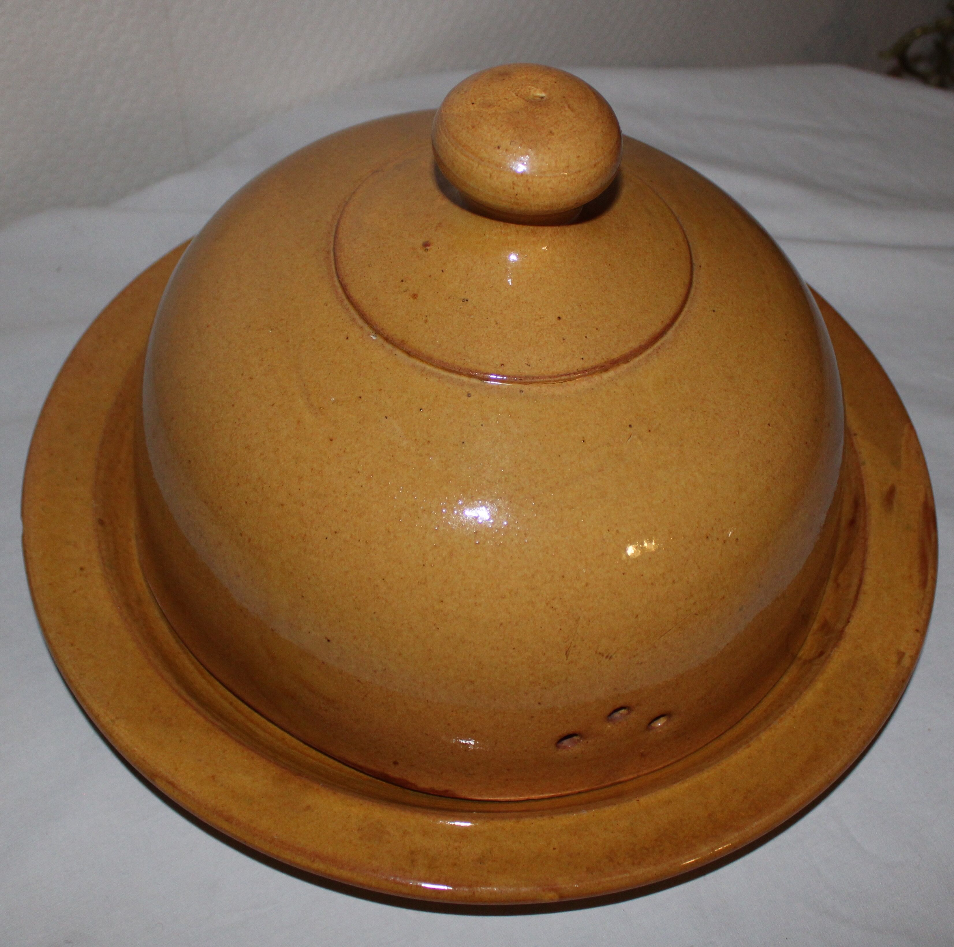 Old vintage glazed earth cheese bell