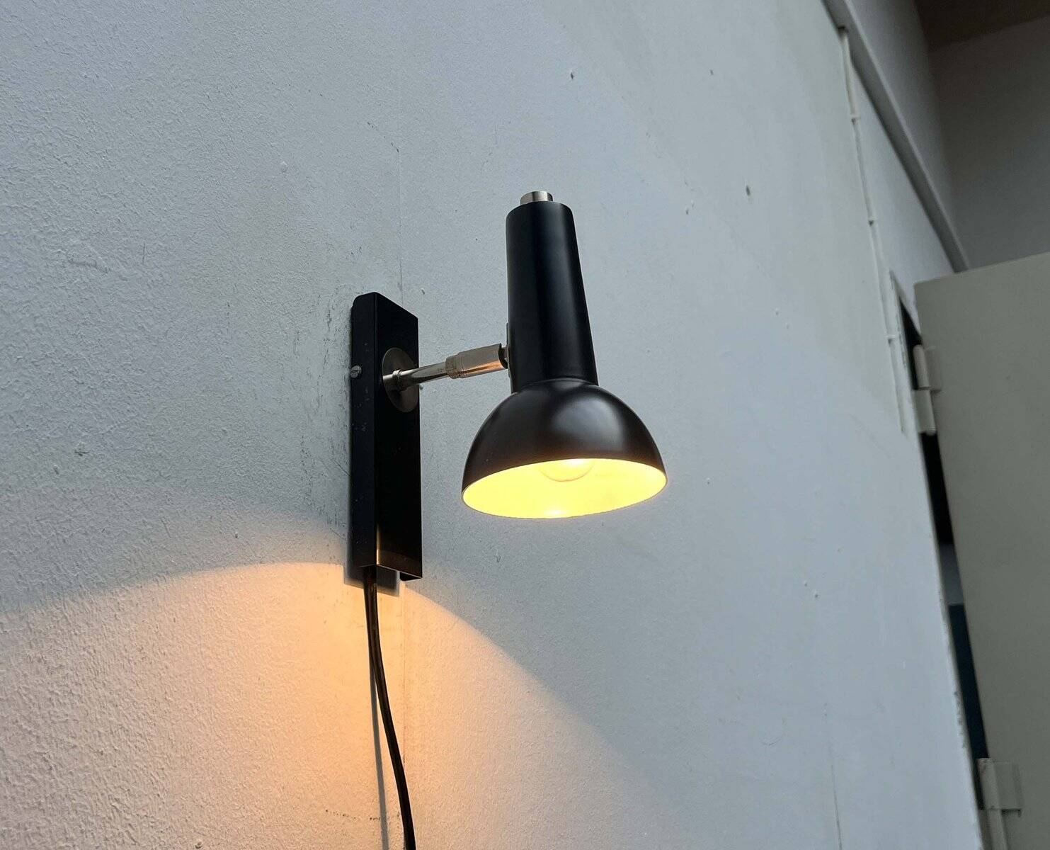 Mid-century German black minimalist wall lamp by Hustadt, 1960s.