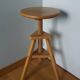 Tripod stool with a screw.