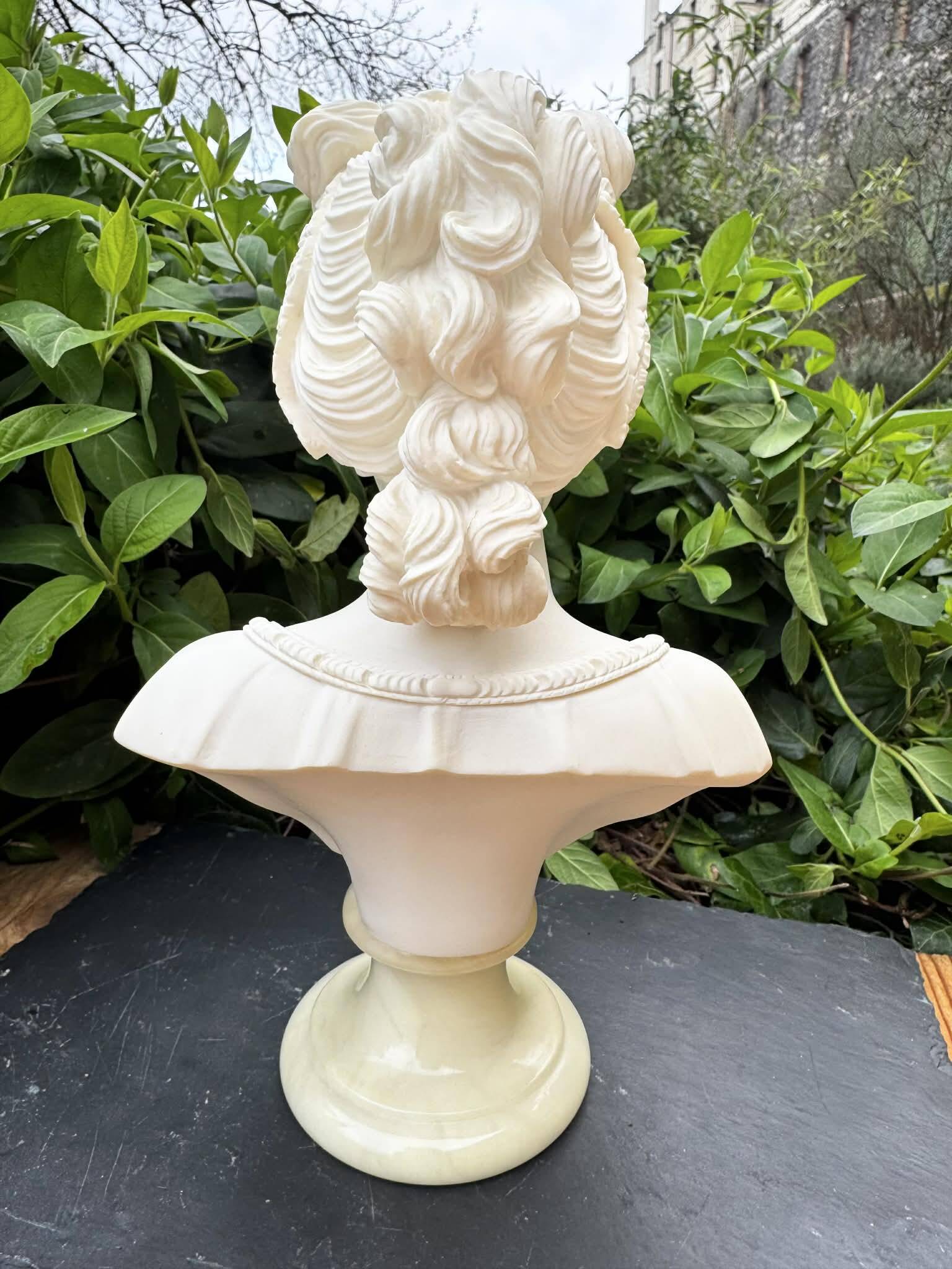 Alabaster bust of a woman signed Arnaldo Giannelli dated 1980.