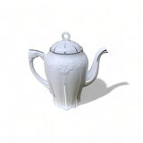 Porcelain coffee pot with floral pattern and silver stem
