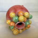 Small tripod vase with multicolored marbles
