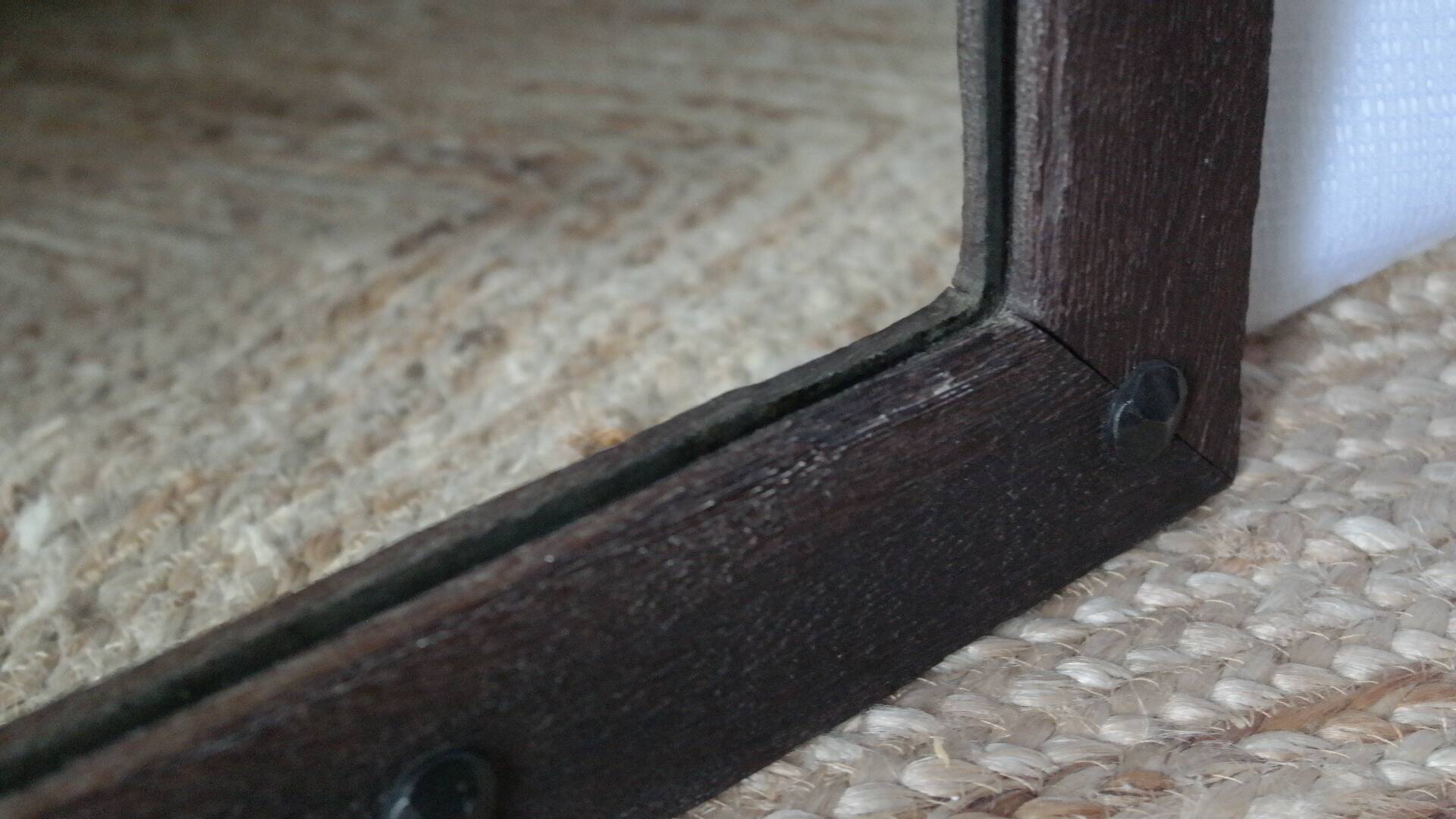 Old handcrafted Gothic style wooden mirror