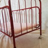 Vintage doll bed large model in red lacquered metal and matching mattress