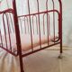 Vintage doll bed large model in red lacquered metal and matching mattress