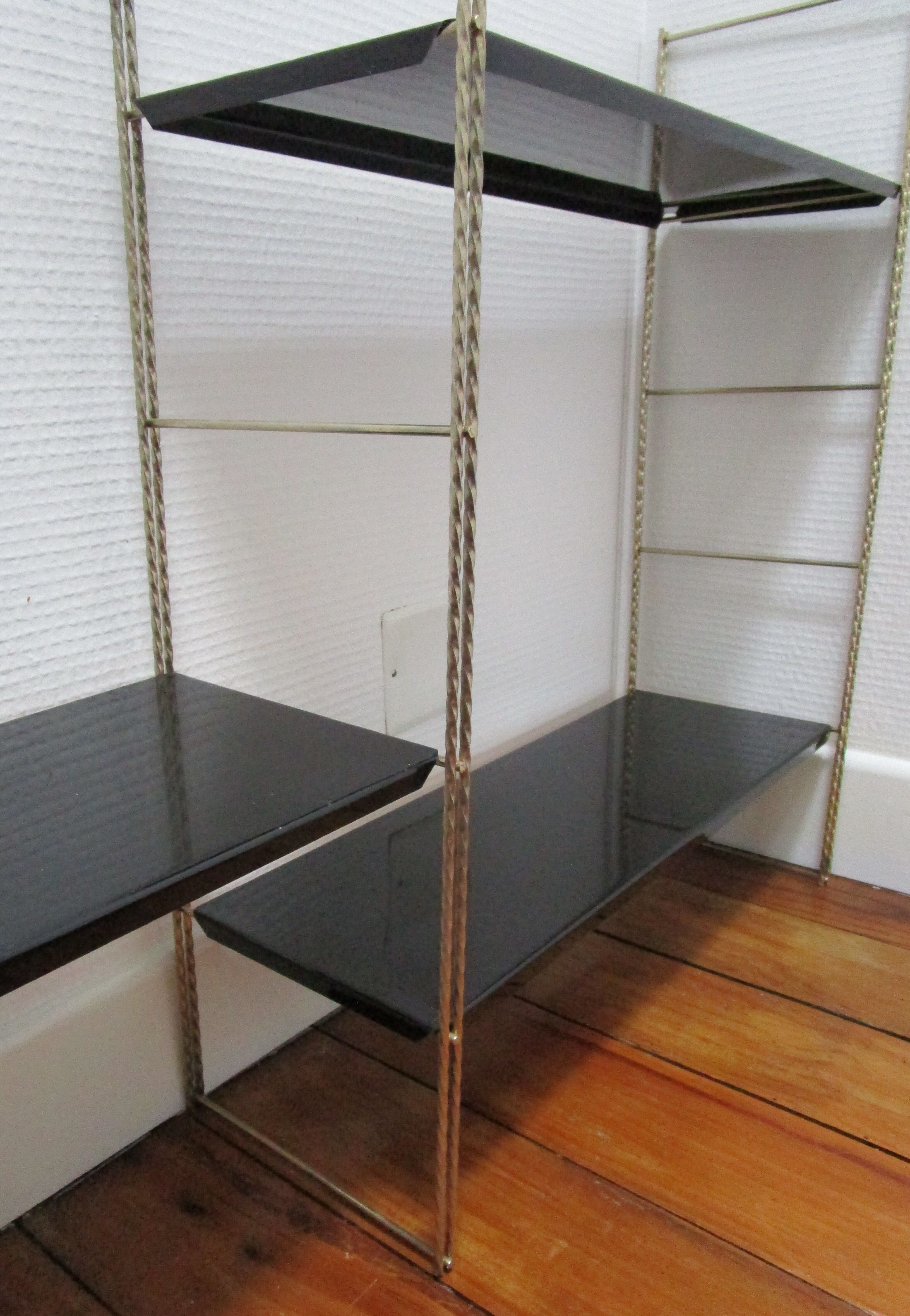 Black and gold metal tomado wall shelf