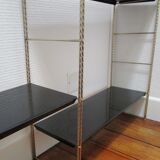 Black and gold metal tomado wall shelf