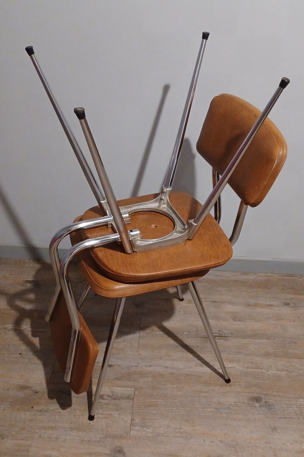 Pair of vintage faux leather and chrome chairs